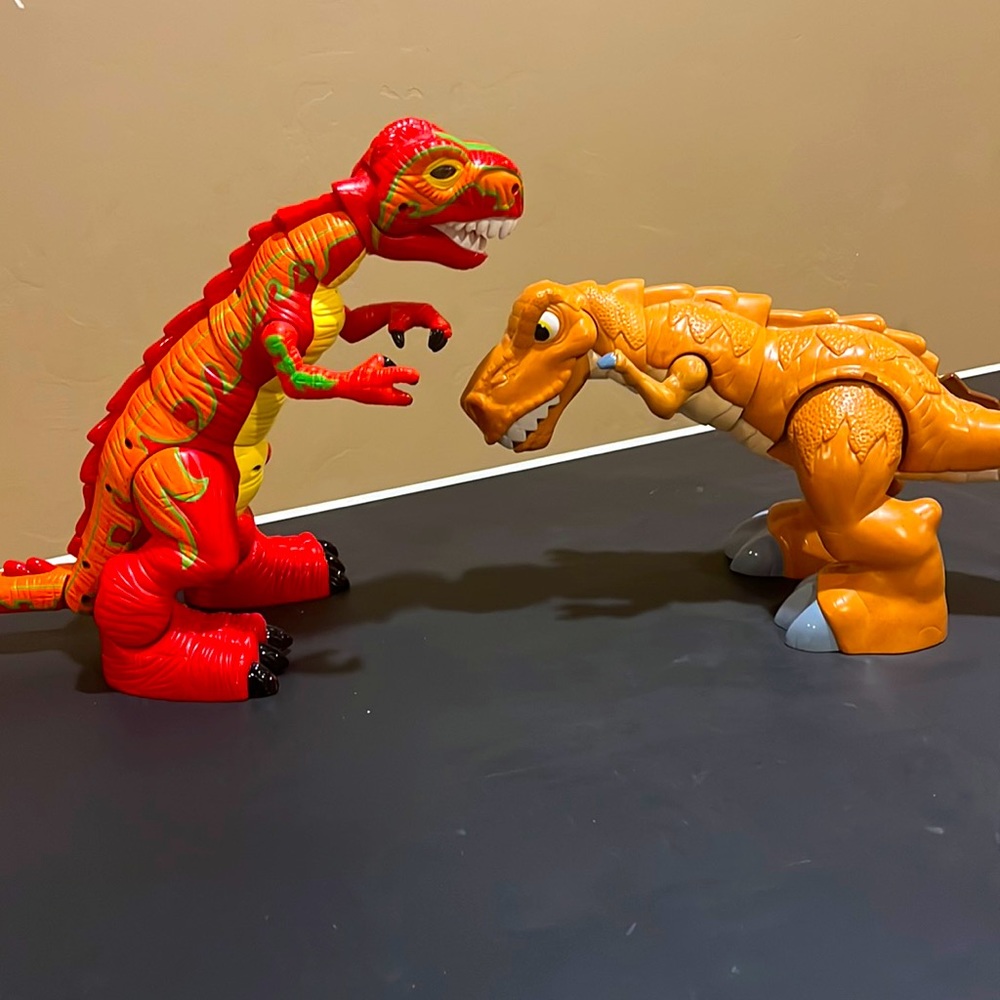 2 Fisher Price T-Rex dinosaur action figures. 2005 and 2011 models.